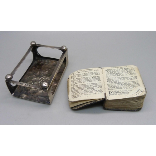 857 - A silver matchbox holder and a prayer book with silver cover, a/f, both with Reynolds Angels detail,... 