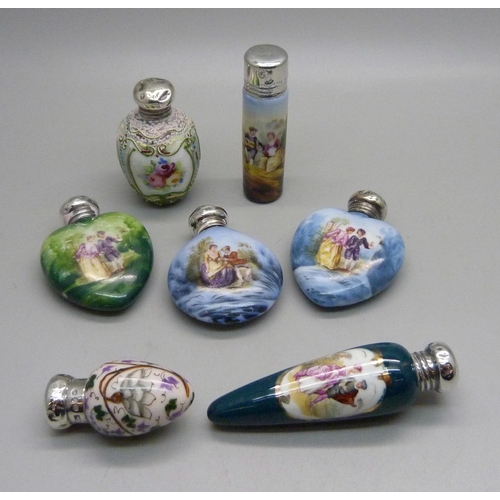 862 - A collection of seven hand painted continental scent bottles with hallmarked silver lids, all lids d... 