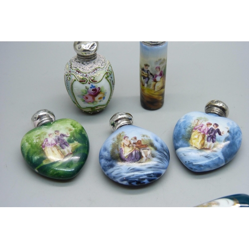 862 - A collection of seven hand painted continental scent bottles with hallmarked silver lids, all lids d... 