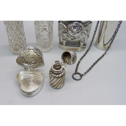 863 - A silver pill box and five silver and silver mounted scent bottles