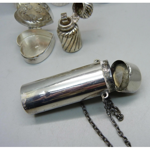 863 - A silver pill box and five silver and silver mounted scent bottles