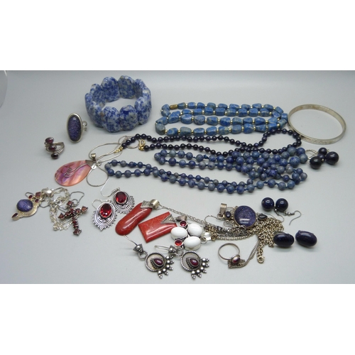 869 - A collection of silver and silver set blue stone jewellery