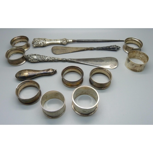 875 - A set of six silver napkin rings, one a/f, three other silver napkin rings, three silver handled imp... 