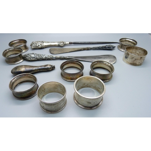 875 - A set of six silver napkin rings, one a/f, three other silver napkin rings, three silver handled imp... 