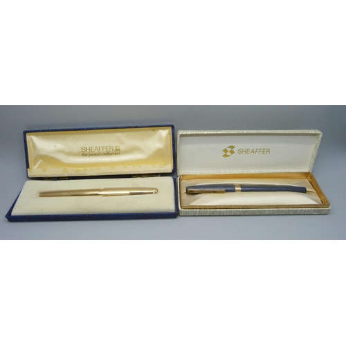 878 - Two boxed Sheaffer pens, one with 14ct gold nib and '12k G.F.' body and cap