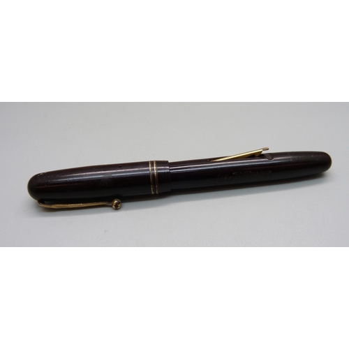 883 - A Swan pen with 14ct gold nib, (Parker box)