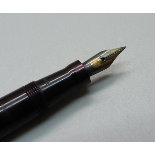 883 - A Swan pen with 14ct gold nib, (Parker box)