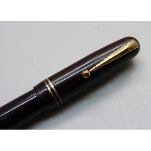 883 - A Swan pen with 14ct gold nib, (Parker box)