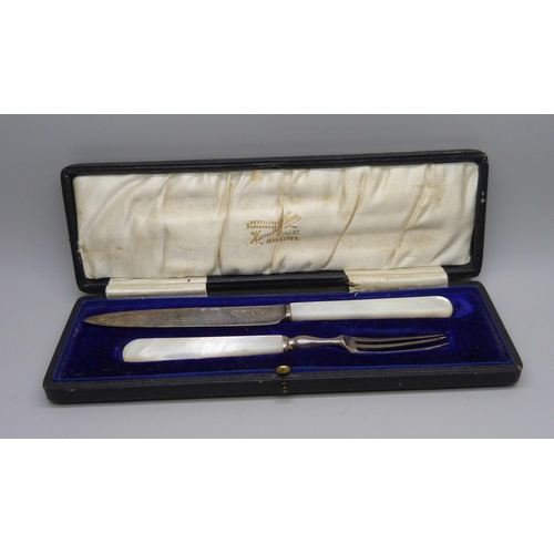 884 - A silver and mother of pearl handled knife and fork christening set, Sheffield 1912, Isaac Ellis & S... 