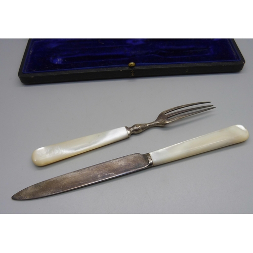 884 - A silver and mother of pearl handled knife and fork christening set, Sheffield 1912, Isaac Ellis & S... 