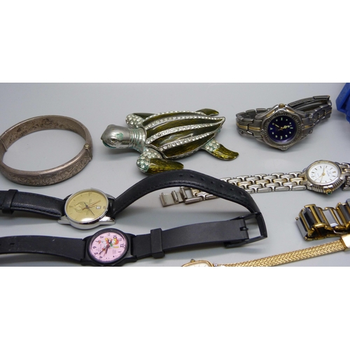 898 - A silver bangle and lady's wristwatches