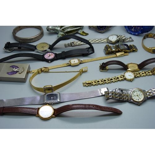 898 - A silver bangle and lady's wristwatches