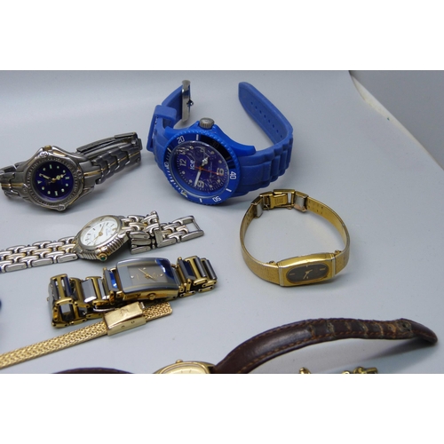 898 - A silver bangle and lady's wristwatches