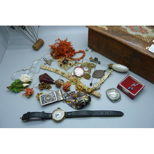 908 - A box of jewellery including amber, coral, silver, hat pins, etc.