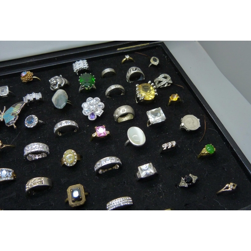 927 - A ring tray and sixty costume rings