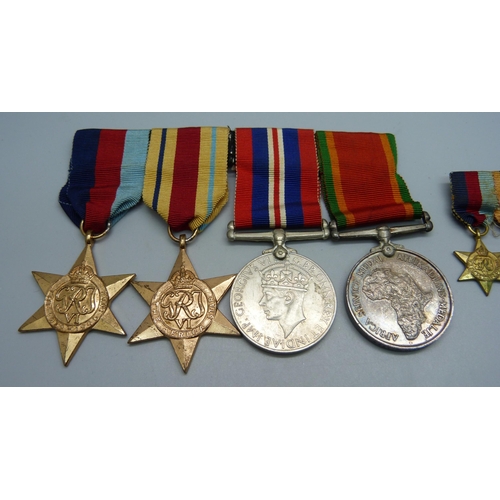 948 - A set of four WWII medals and miniatures including Africa Service Medal to 4221 K.O. Abbot