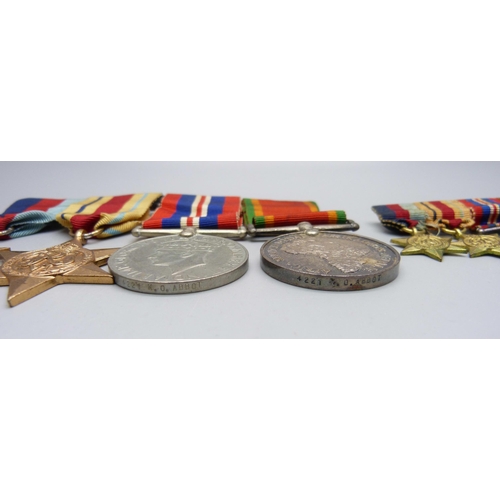 948 - A set of four WWII medals and miniatures including Africa Service Medal to 4221 K.O. Abbot