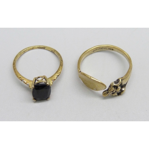 950 - Two silver gilt rings including black stone set with diamond shoulders, S and O