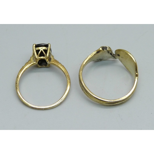 950 - Two silver gilt rings including black stone set with diamond shoulders, S and O