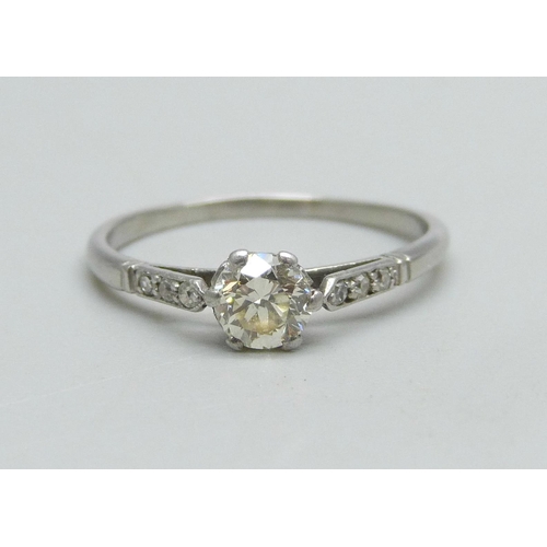 959 - A white metal and diamond solitaire ring with diamond shoulders, 2.3g, N