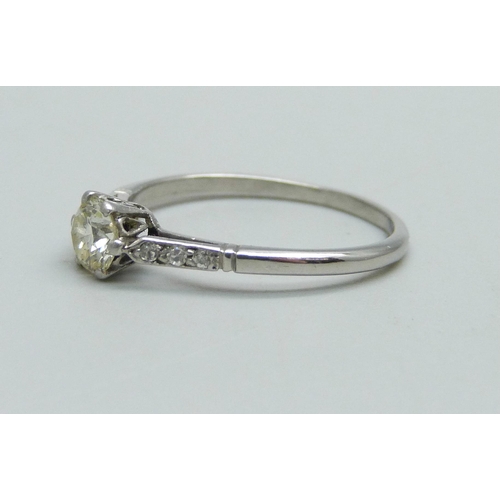 959 - A white metal and diamond solitaire ring with diamond shoulders, 2.3g, N