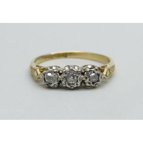 962 - An 18ct gold and platinum set diamond trilogy ring, 2.9g, O