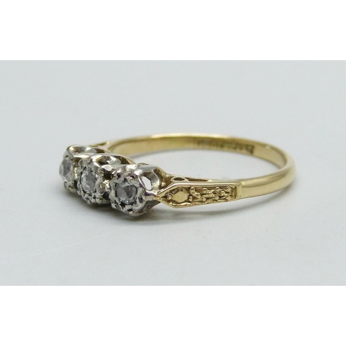 962 - An 18ct gold and platinum set diamond trilogy ring, 2.9g, O