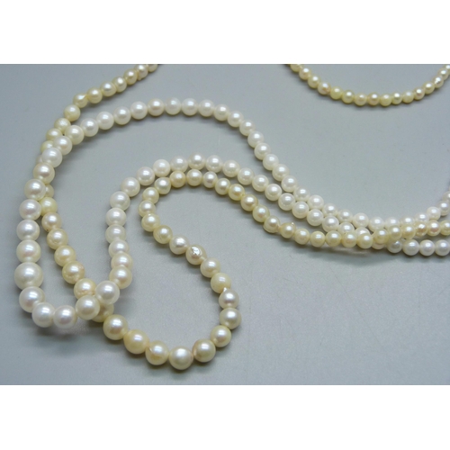 976 - Two faux pearl necklaces on a 9ct gold double clasp