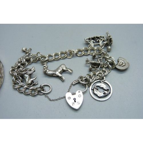 979B - A silver bangle and a silver charm bracelet, 51g