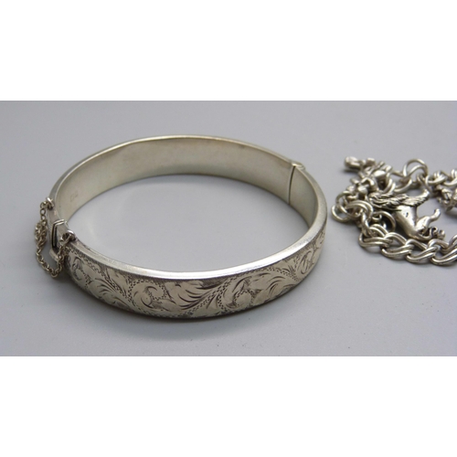 979B - A silver bangle and a silver charm bracelet, 51g