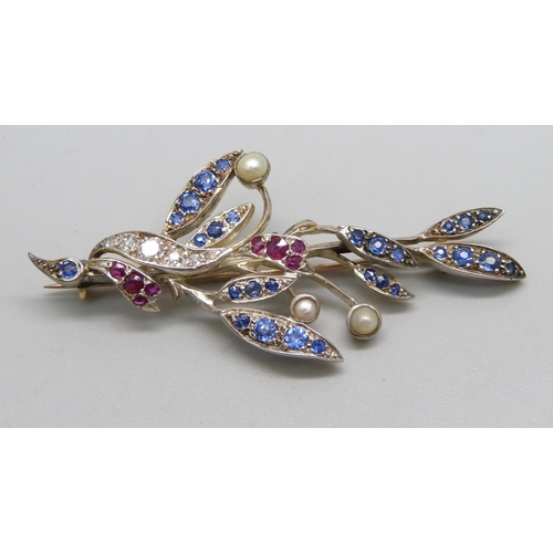 983 - A white metal set, diamond, ruby and sapphire brooch, also set with three seed pearls, a/f, 10.9g, 6... 