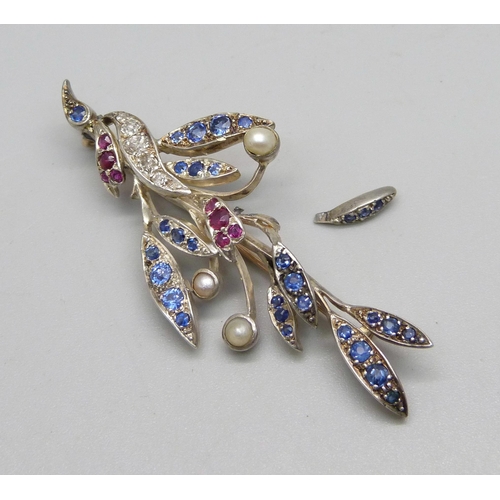 983 - A white metal set, diamond, ruby and sapphire brooch, also set with three seed pearls, a/f, 10.9g, 6... 