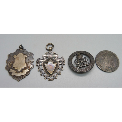 992 - Two large silver fob medals, a silver wound badge, 38304, lacking pin, and a silver 1884 Colombian c... 