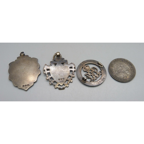 992 - Two large silver fob medals, a silver wound badge, 38304, lacking pin, and a silver 1884 Colombian c... 