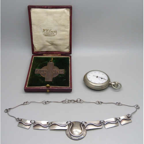 998 - A base metal stop watch, an 'All In One' bronze medallion, cased and an Arts and Crafts necklet