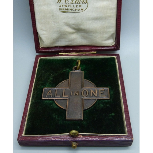 998 - A base metal stop watch, an 'All In One' bronze medallion, cased and an Arts and Crafts necklet