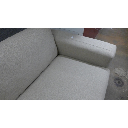 1452 - A sandstone weave four seater sofa