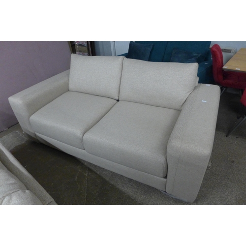 1453 - A sandstone weave three seater sofa