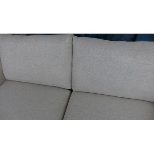 1453 - A sandstone weave three seater sofa