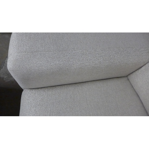 1453 - A sandstone weave three seater sofa