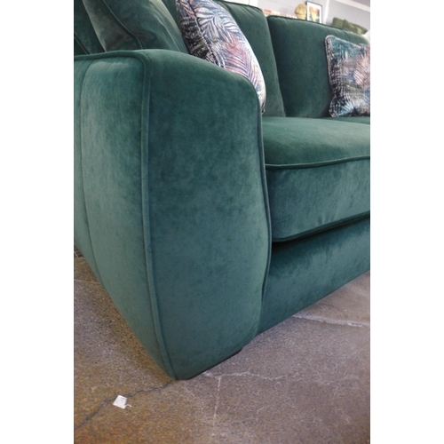 1475 - A deep green velvet three seater sofa