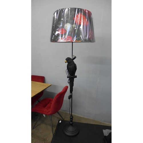 1476 - A floor standing parrot lamp with floral shade