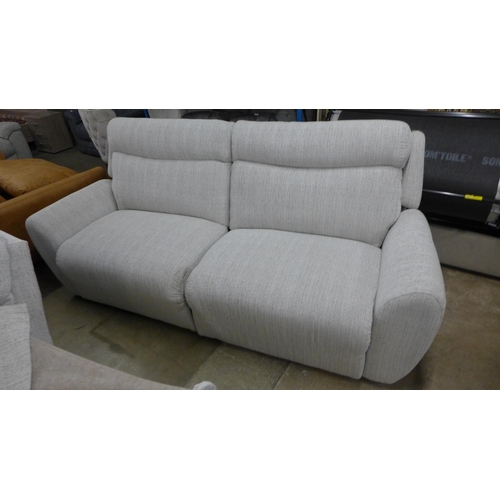 1477 - A light stone three seater reclining sofa