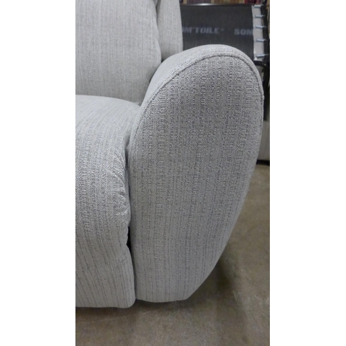 1477 - A light stone three seater reclining sofa