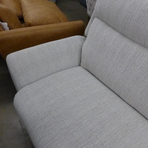 1477 - A light stone three seater reclining sofa