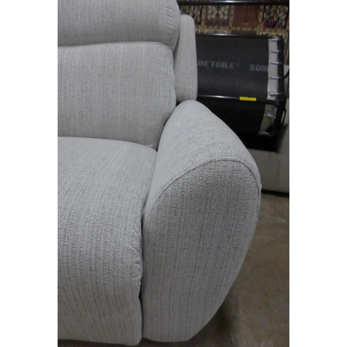 1478 - A light stone three seater reclining sofa