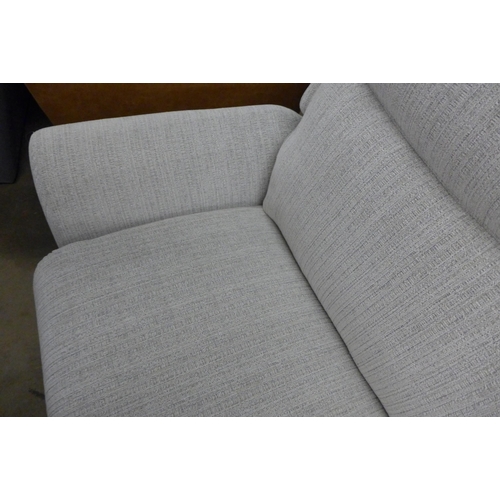 1478 - A light stone three seater reclining sofa