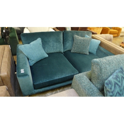 1482 - A turquoise upholstered three seater sofa