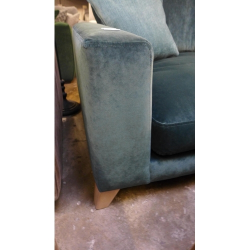 1482 - A turquoise upholstered three seater sofa