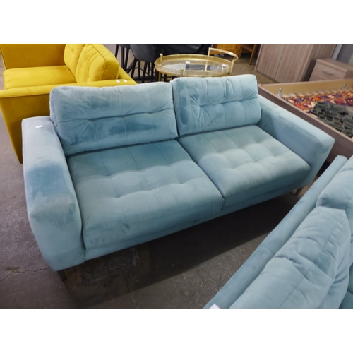 1488 - A pale blue velvet three seater sofa (sun damaged)